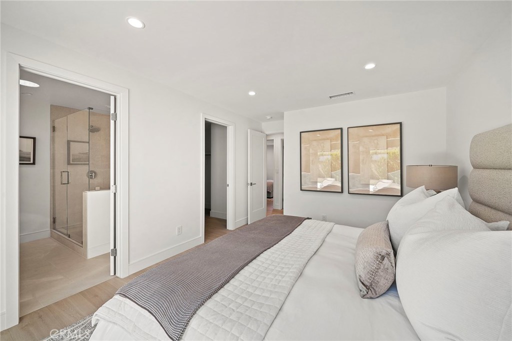 Primary suite has giant walk-in closet and spa-inspired ensuite bathroom - 20852 Farnsworth Lane, Huntington Beach CA 92646 - photo 19