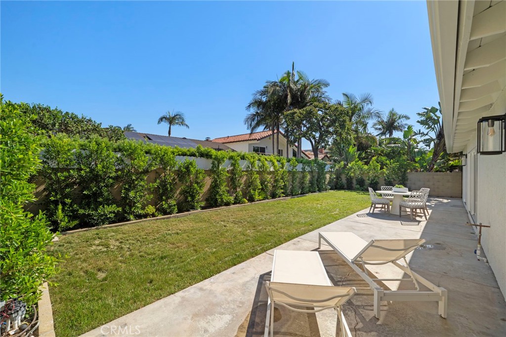 Tranquil private backyard with large patio, lawn, block wall fencing, and new landscaping - 20852 Farnsworth Lane, Huntington Beach CA 92646 - photo 28