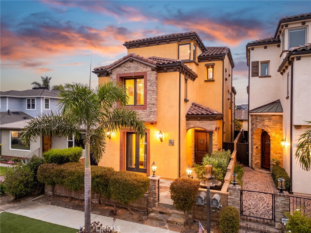 Front of the house (twilight photo) - 212 Baltimore Avenue, Huntington Beach CA 92648 - photo 1