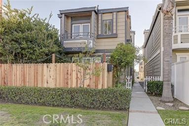 Front fenced downstairs patio unit - 212 Rochester, Huntington Beach CA 92648 - photo 1