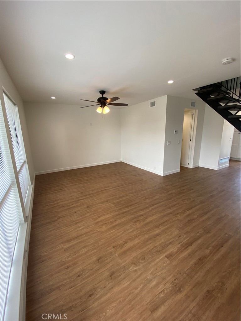 View upon entry of the large living room. - 21292 GREENSPRAY Lane, Huntington Beach CA 92646 - photo 4