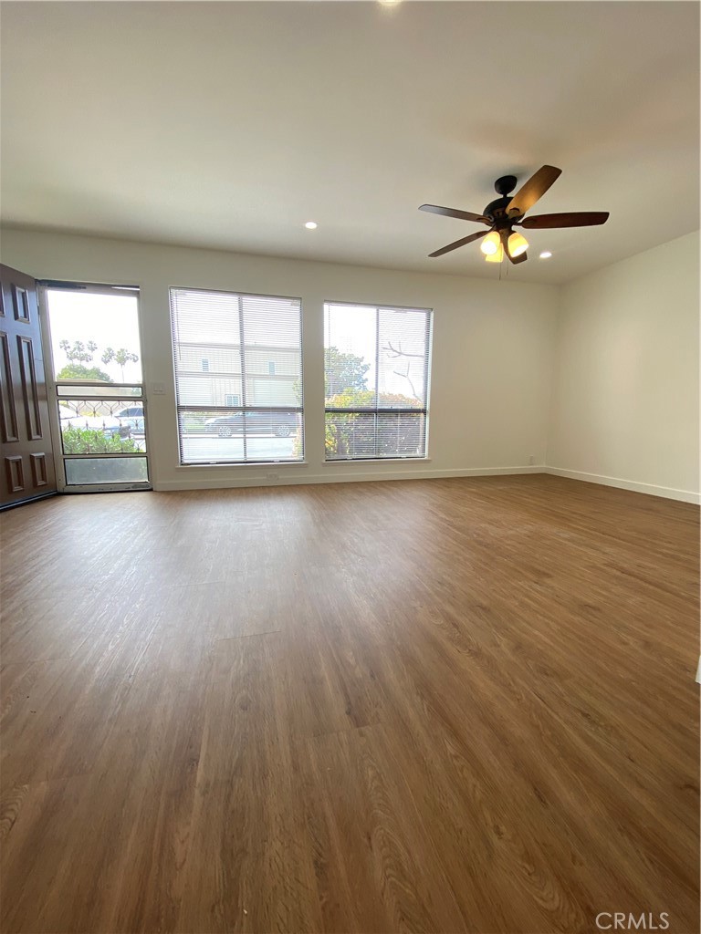 This large living room faces the front of the home and local Gisler Park - 21292 GREENSPRAY Lane, Huntington Beach CA 92646 - photo 5