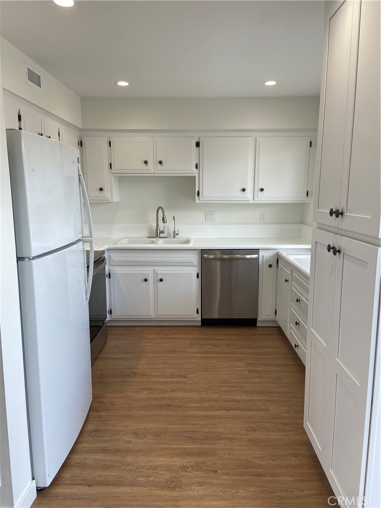 Well appointed kitchen with new dishwasher. - 21292 GREENSPRAY Lane, Huntington Beach CA 92646 - photo 9