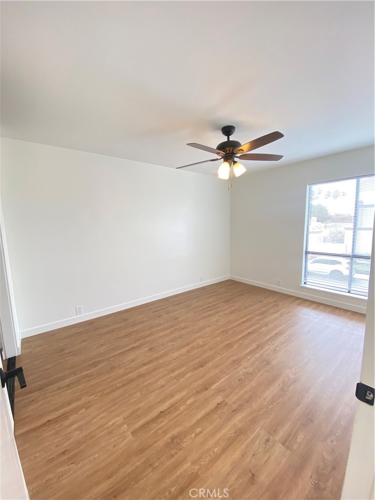 Large bedroom overlooking the front. - 21292 GREENSPRAY Lane, Huntington Beach CA 92646 - photo 12