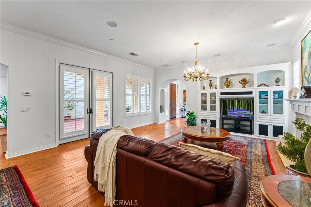 Open Concept Living Room with Custom Built-In Entertainment Center. - 21306 Balerma, Huntington Beach CA 92648 - photo 8