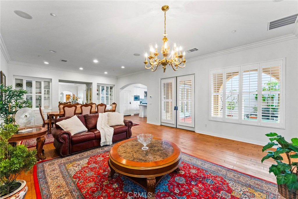 Custom plantation shutters, extensive crown molding, volume ceilings, graceful arched passages, tall French doors, reces - 21306 Balerma, Huntington Beach CA 92648 - photo 12