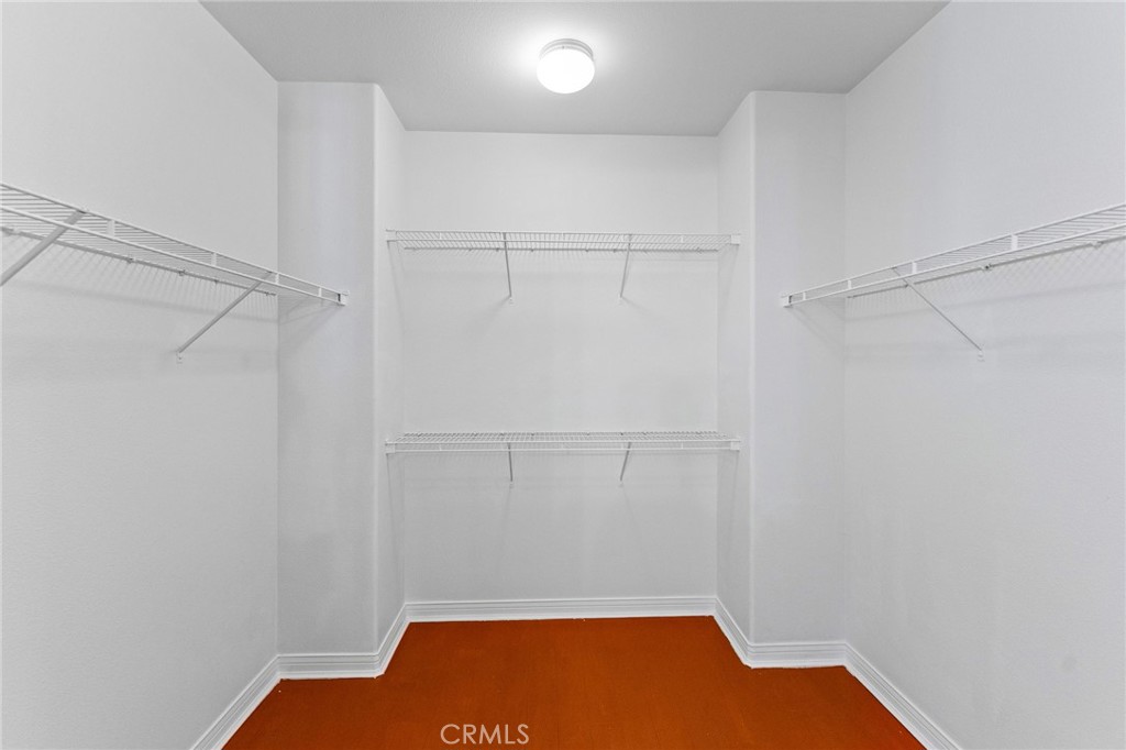 Walk-In closet in primary bathroom. - 21306 Balerma, Huntington Beach CA 92648 - photo 39