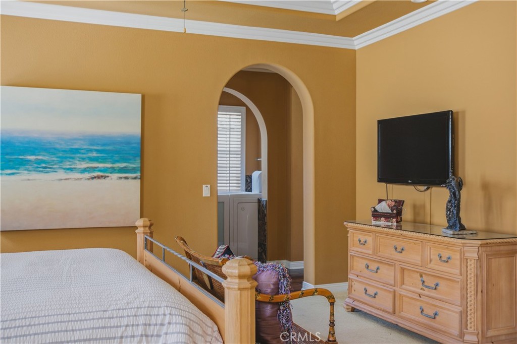 Upper-level Primary bedroom archway entry into ensuite bathroom. - 21322 Balerma, Huntington Beach CA 92648 - photo 19