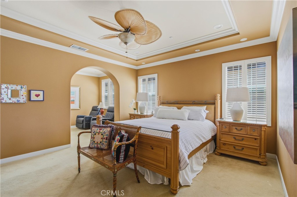 Upper-level Primary bedroom with archway opening into separate sitting area. - 21322 Balerma, Huntington Beach CA 92648 - photo 28