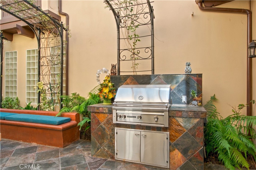 Enclosed courtyard with custom built outdoor BBQ. - 21322 Balerma, Huntington Beach CA 92648 - photo 47