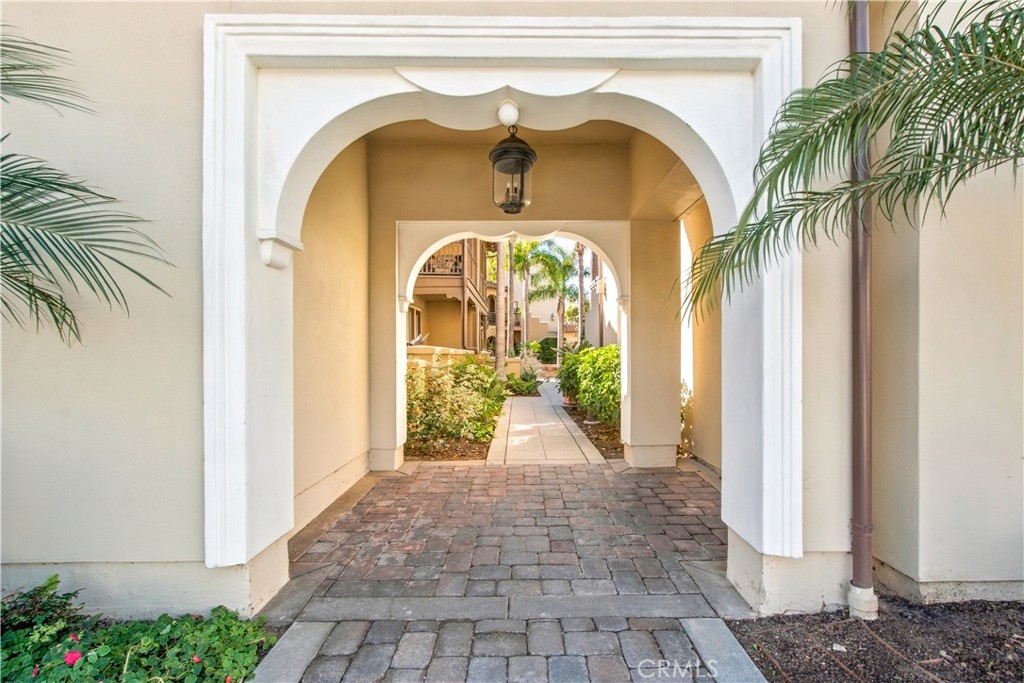 Step into a beautiful courtyard with lush landscaping. - 21335 Cieza, Huntington Beach CA 92648 - photo 5