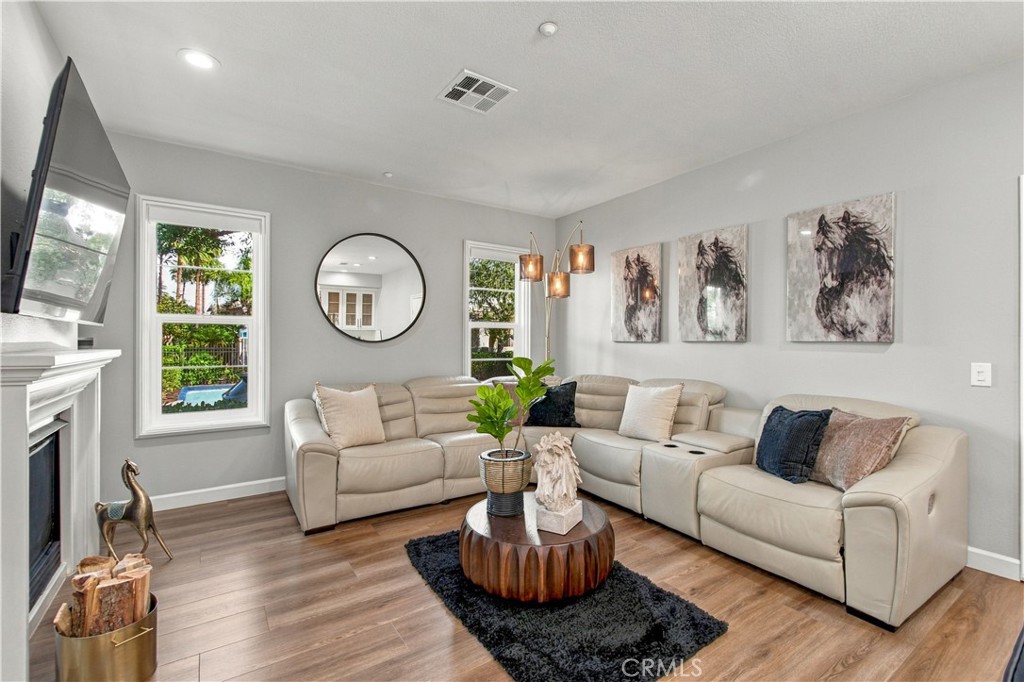 Upgrades galore include soaring ceilings, waterproof luxury vinyl plank flooring throughout! - 21335 Cieza, Huntington Beach CA 92648 - photo 11