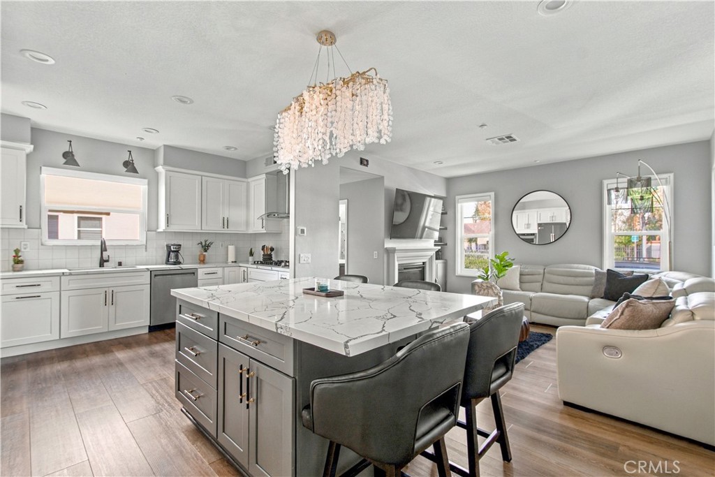 Open concept living with a showstopping chef-inspired kitchen and gathering space. - 21335 Cieza, Huntington Beach CA 92648 - photo 15