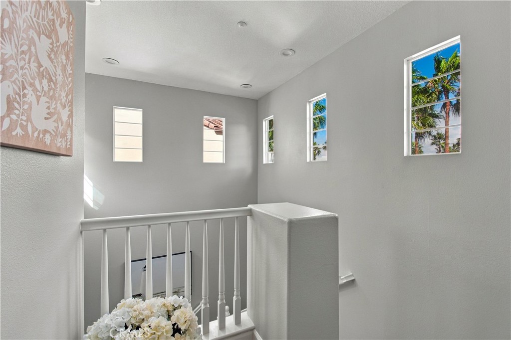Upstairs, retreat to two spacious bedroom suites, each with a walk-in closet and beautifully remodeled private bath. - 21335 Cieza, Huntington Beach CA 92648 - photo 27