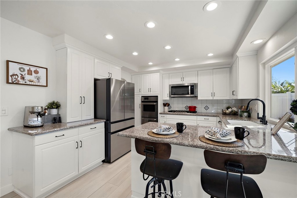 Light and bright remodeled kitchen - 21341 Seaforth Lane, Huntington Beach CA 92646 - photo 13