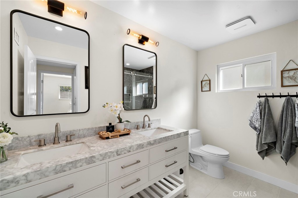 Recently remodeled with stylish vanities, marble-look countertops - 21341 Seaforth Lane, Huntington Beach CA 92646 - photo 19
