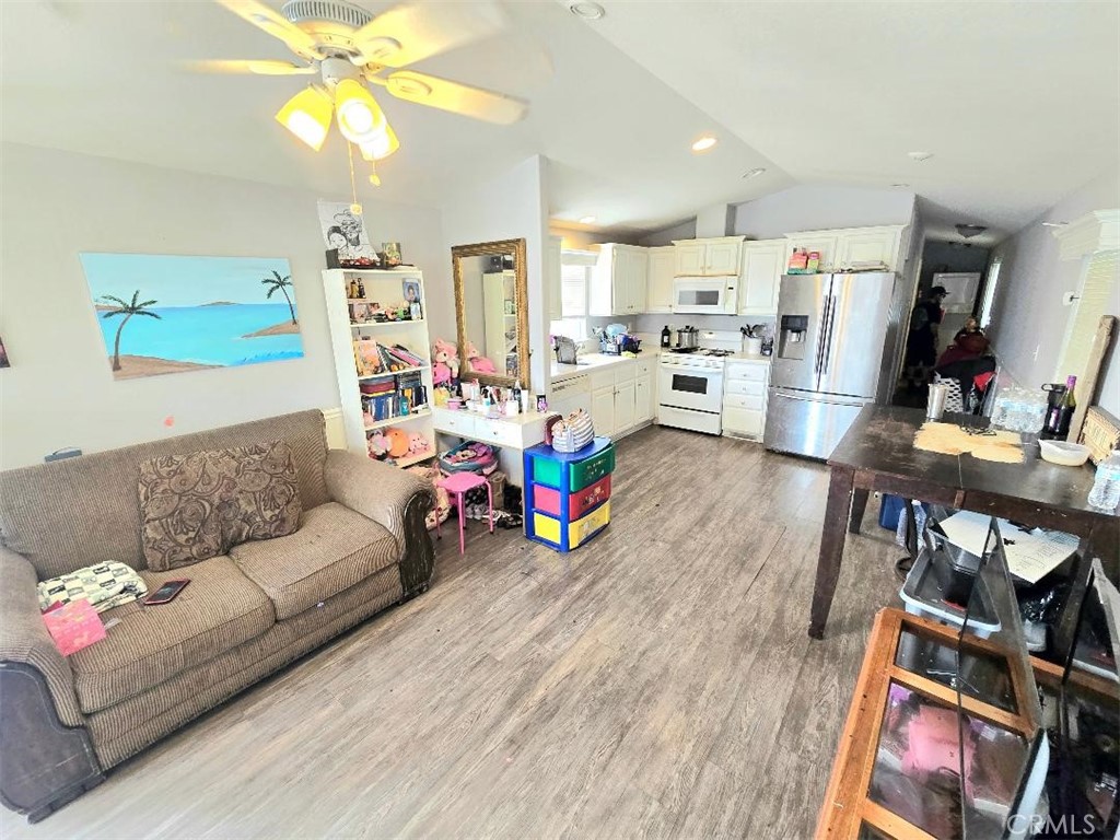 living room / kitchen - 21752 Pacific Coast Hwy 7A, Huntington Beach CA 92646 - photo 6