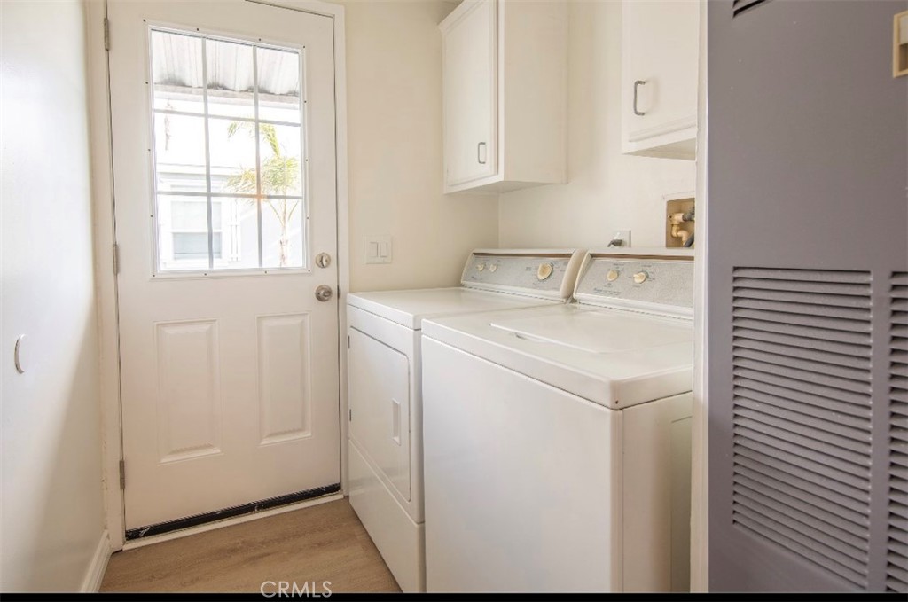 Laundry Room with washer and dryer - 21752 Pacific Coast, Huntington Beach CA 92646 - photo 10