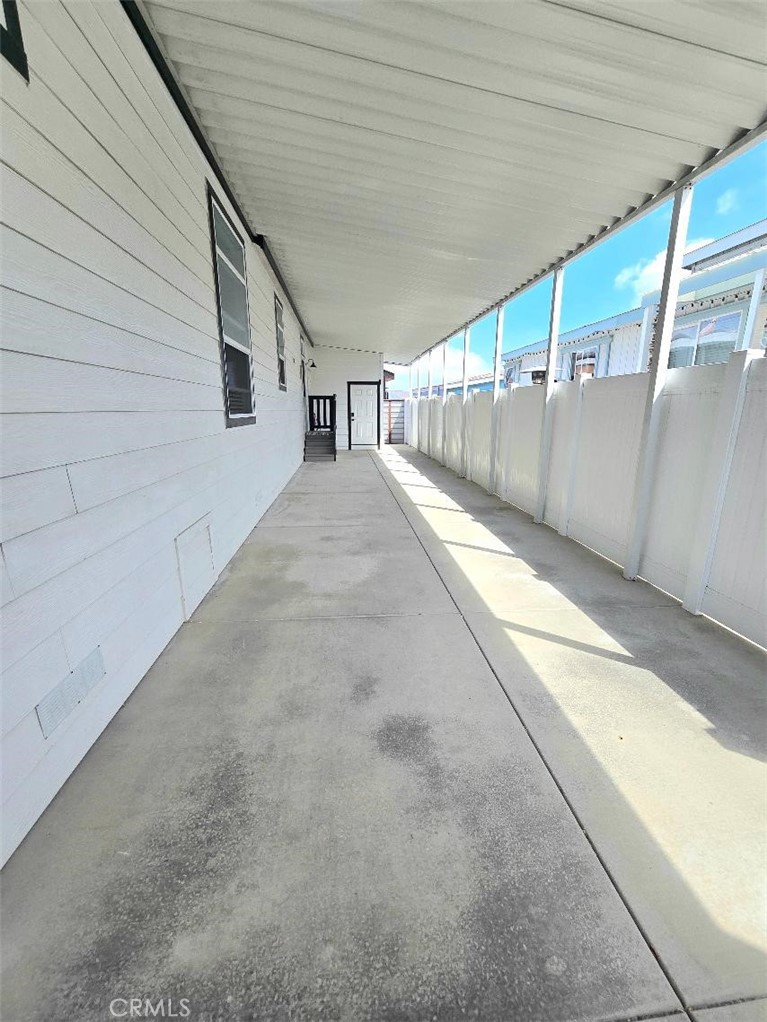 Carport driveway - 21851 Newland St 297, Huntington Beach CA 92646 - photo 57
