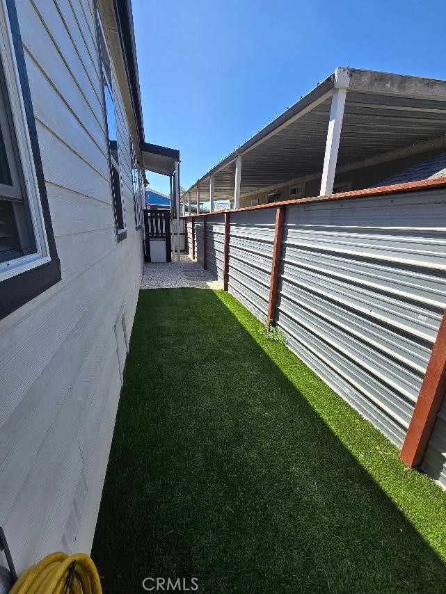 Back​​‌​​​​‌​​‌‌​​‌‌​​‌‌​​‌​​​‌‌​‌​​​​‌‌​‌​​ yard - 21851 Newland St 297, Huntington Beach CA 92646 - photo 60