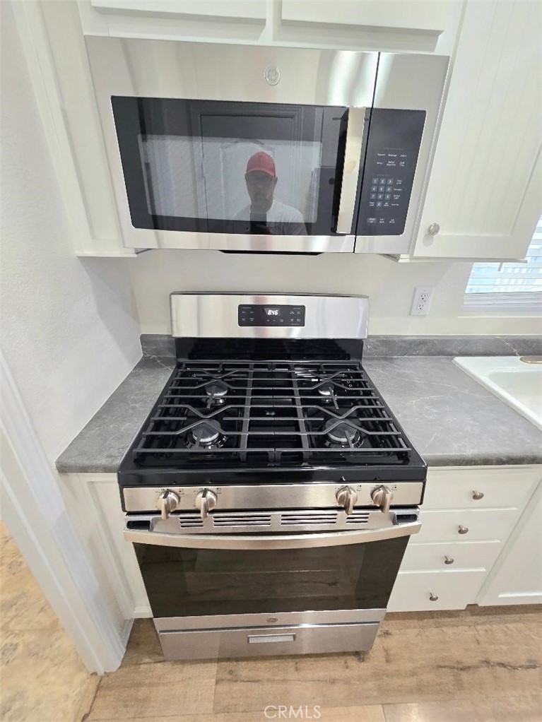 NEW stove and microwave - 21851 Newland St. 43, Huntington Beach CA 92646 - photo 13
