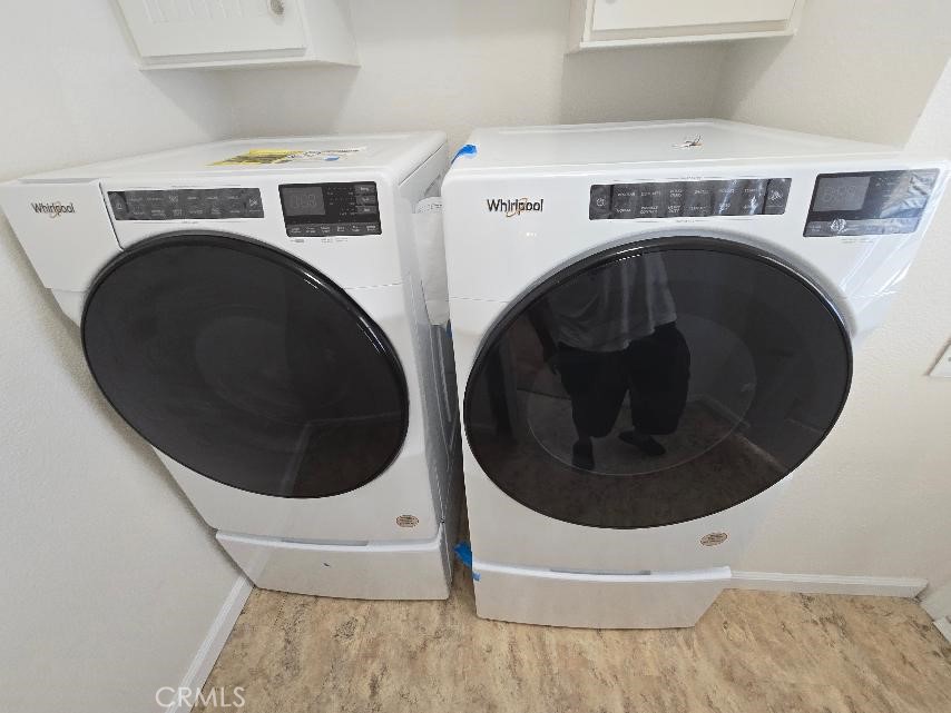 separate laundry room Washer and dryer - 21851 Newland St. 43, Huntington Beach CA 92646 - photo 43