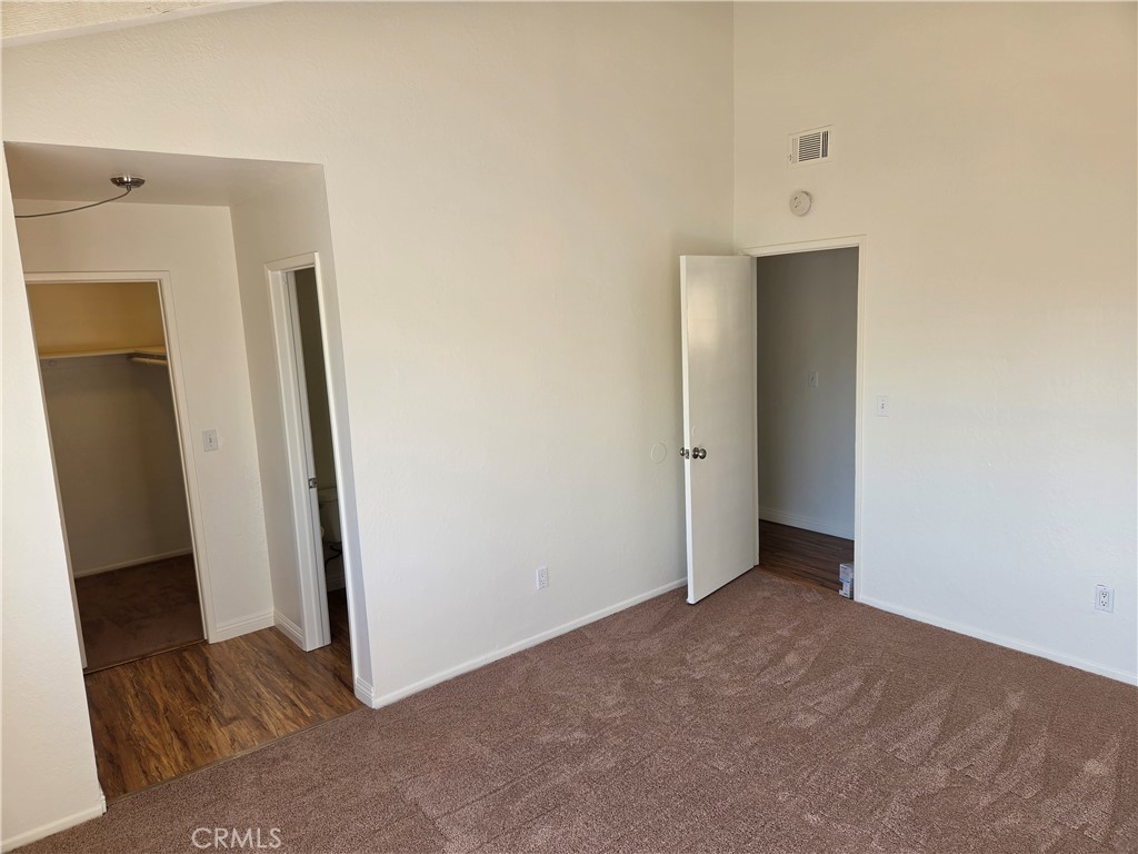 Master Bedroom, with walk in closet. - 219 Oswego D, Huntington Beach CA 92648 - photo 9