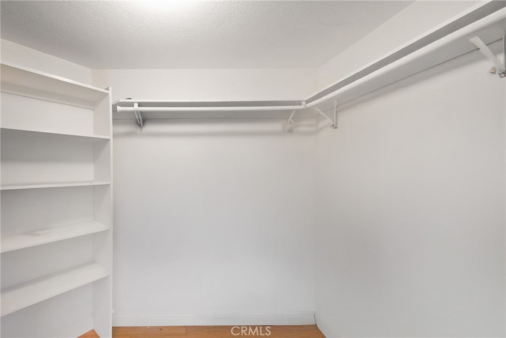 Walk in closet in primary bedroom. - 3361 Tempe, Huntington Beach CA 92649 - photo 7