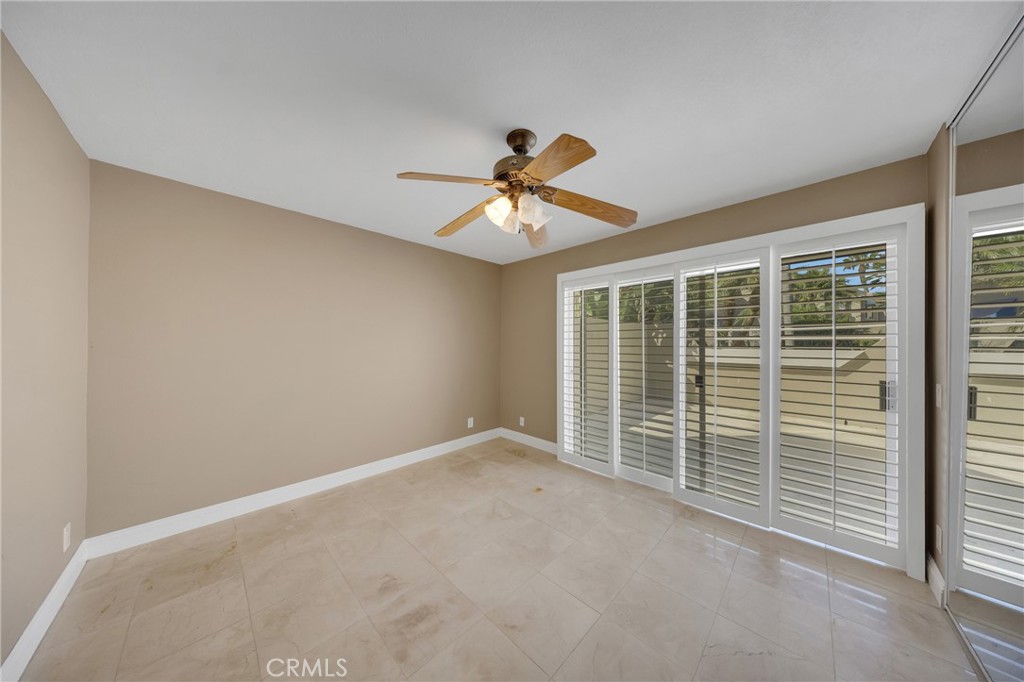 Downstairs bedroom has easy access to patio. - 3361 Tempe, Huntington Beach CA 92649 - photo 24