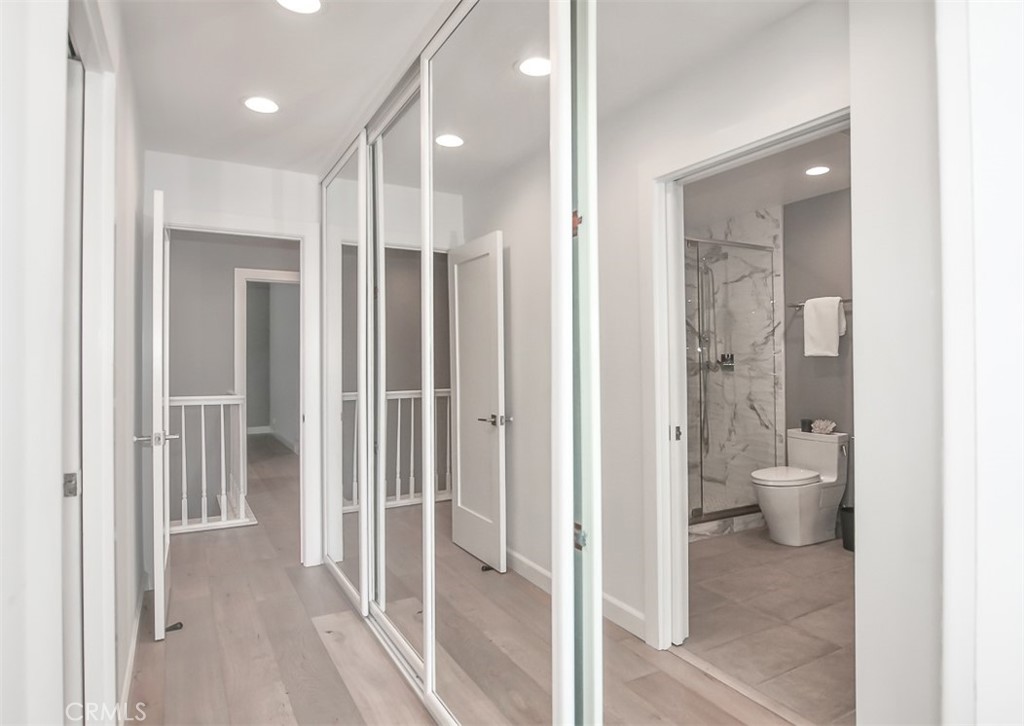 wall of mirrored closets in primary bedroom - 3532 Windspun Drive, Huntington Beach CA 92649 - photo 19