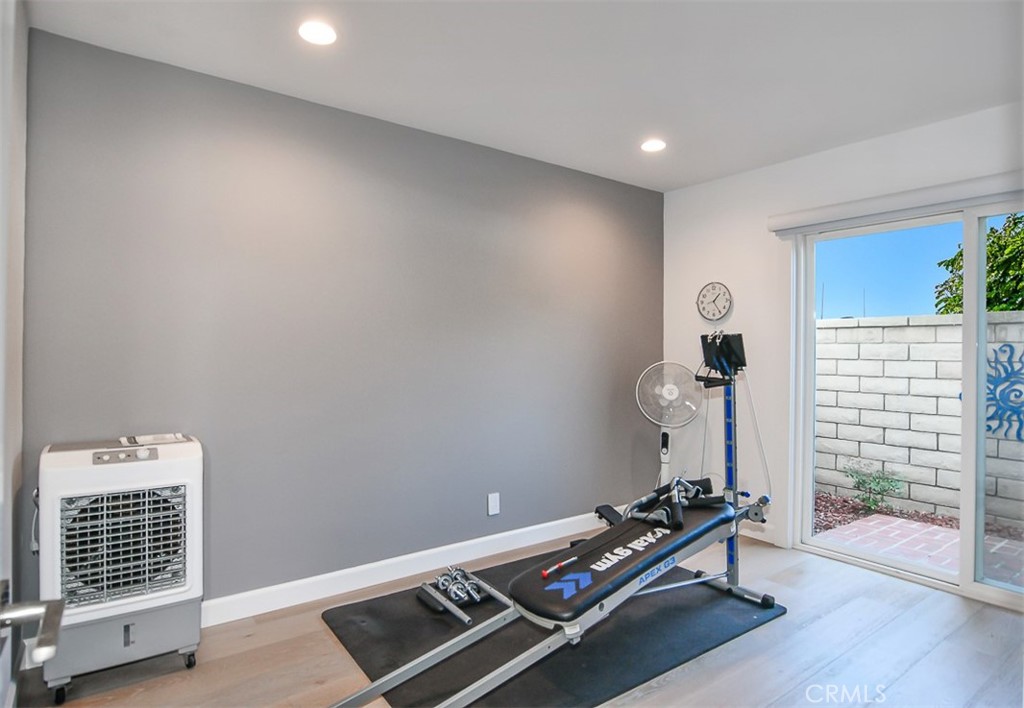 one of the bedrooms is set up as gym (has a barn door closet) - 3532 Windspun Drive, Huntington Beach CA 92649 - photo 26