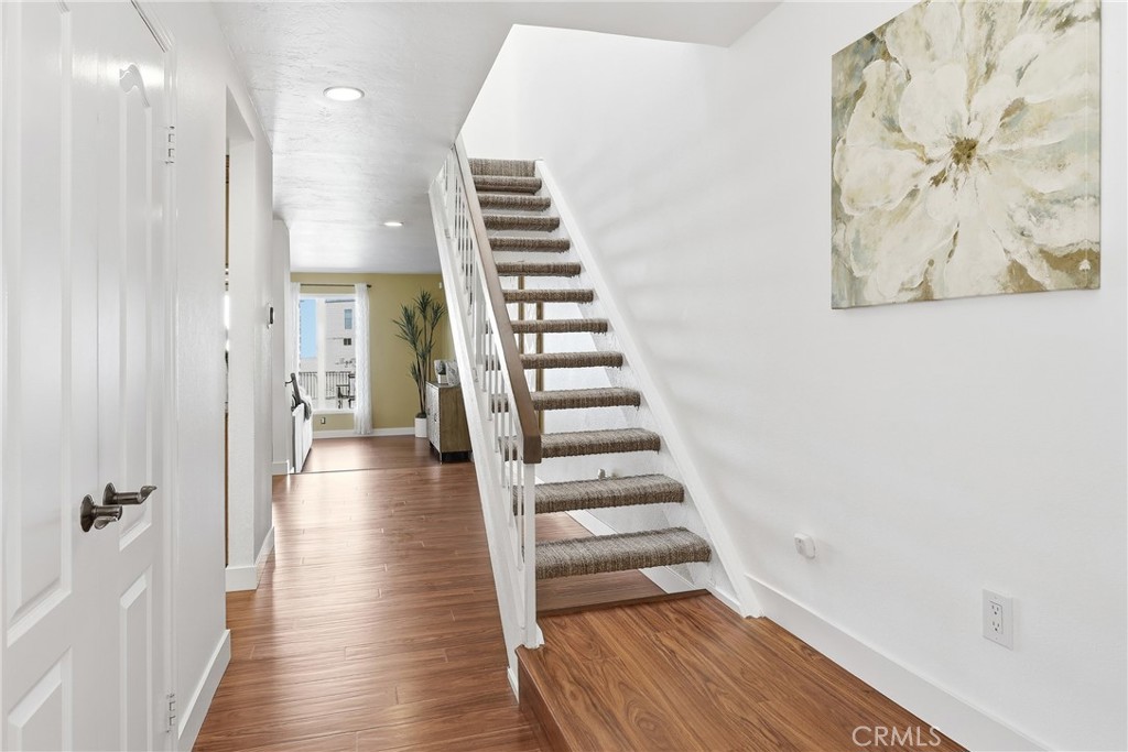 The entryway showcases brand new wood flooring, creating a warm and welcoming first impression. - 3631 Windspun Drive Drive, Huntington Beach CA 92649 - photo 5
