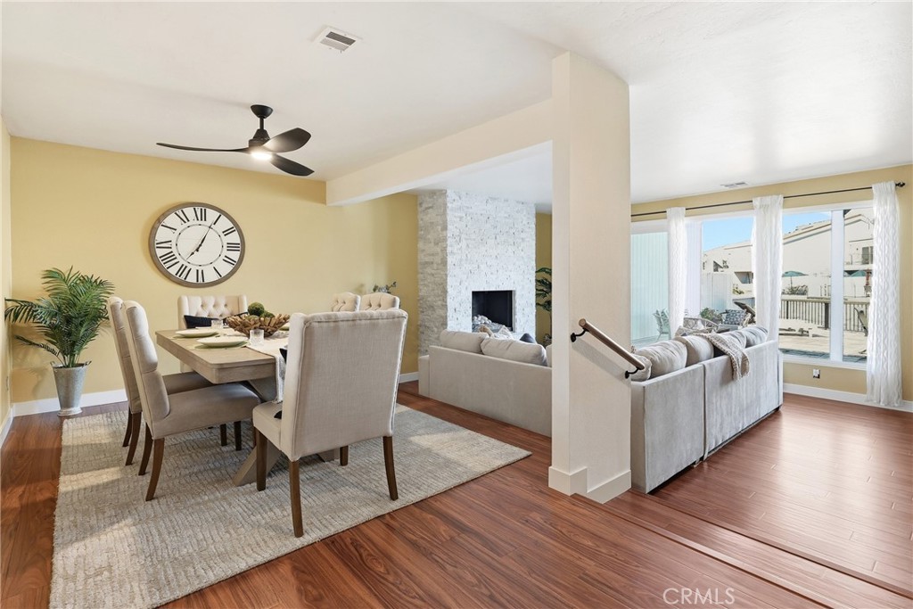 Dining room flows into family room with beautiful waterfront views. - 3631 Windspun Drive Drive, Huntington Beach CA 92649 - photo 8