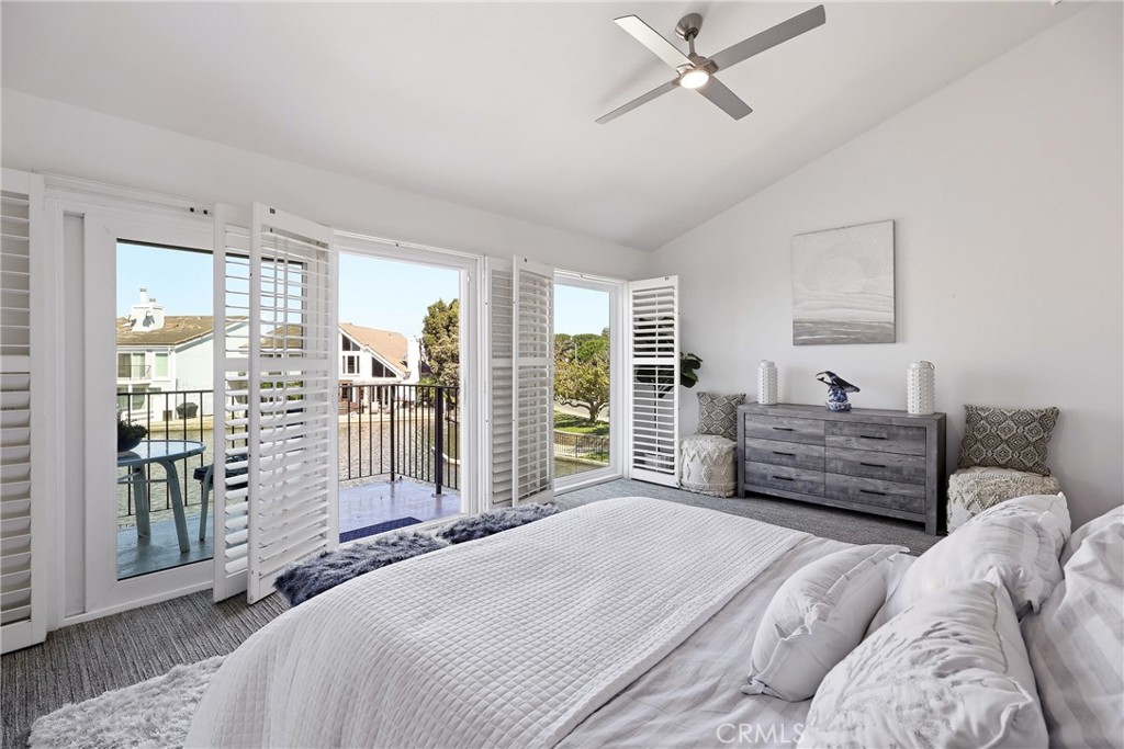 Primary Bedroom offers private balcony with an amzaing view of the Bay. - 3631 Windspun Drive Drive, Huntington Beach CA 92649 - photo 23
