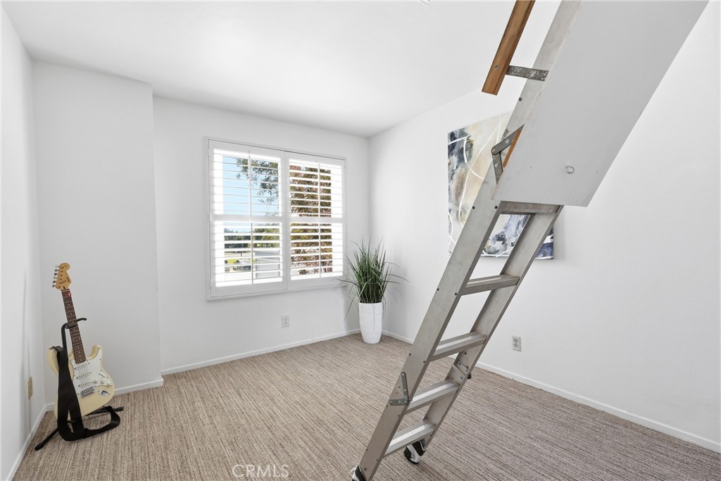 Bedroom #4 offers pull down ladder to access attic. - 3631 Windspun Drive Drive, Huntington Beach CA 92649 - photo 32