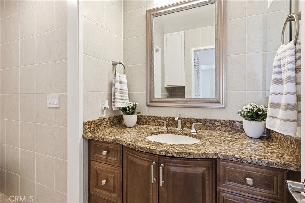 Guest bathroom - elegant granite countertops and stylish finishes. - 3631 Windspun Drive Drive, Huntington Beach CA 92649 - photo 34