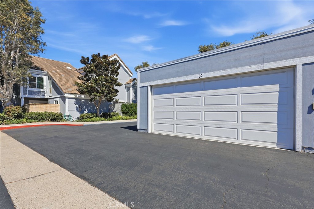 Large 2 car garage is pre-wired for electric vehicle charging, convenient for EV owners. - 3631 Windspun Drive Drive, Huntington Beach CA 92649 - photo 36