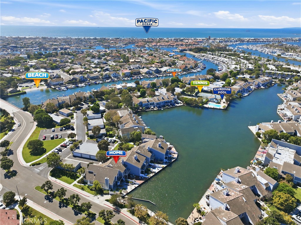 Aerial view showcasing the home's prime waterfront location, private boat dock, clubhouse, pool, and community amenities - 3631 Windspun Drive Drive, Huntington Beach CA 92649 - photo 44