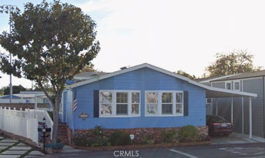 Home has side garden on the east side. - 4292 Lahaina, Huntington Beach CA 92649 - photo 1