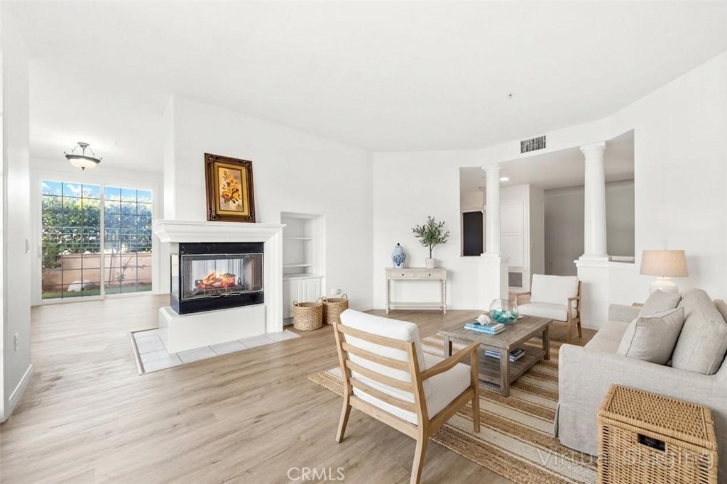 Virtually staged living room - 5142 Warner 112, Huntington Beach CA 92649 - photo 1