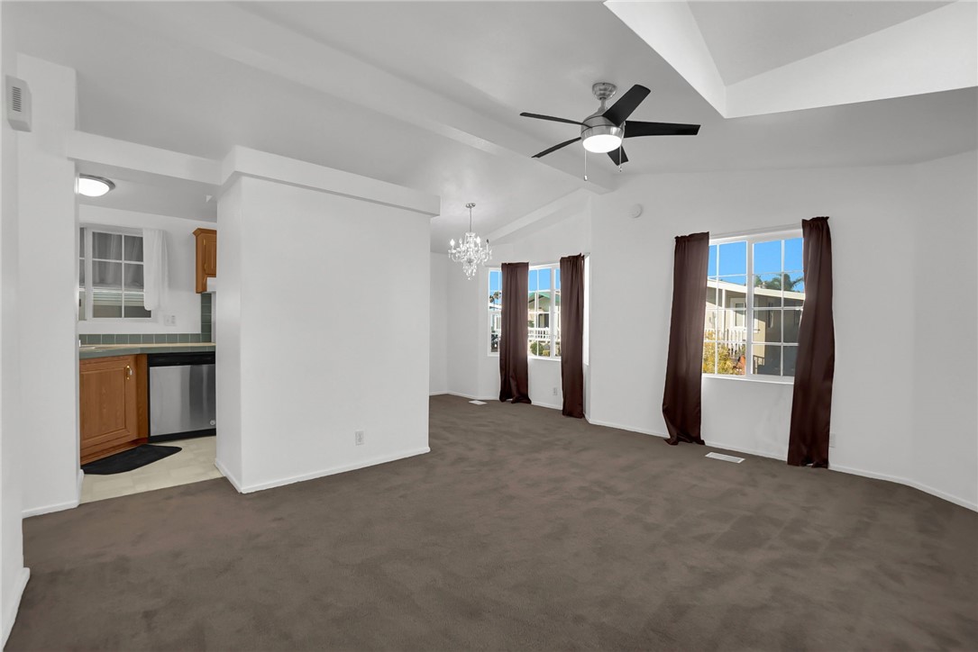 Dinning room with view of kitchen without furniture - 5200 Heil Avenue 28, Huntington Beach CA 92649 - photo 4