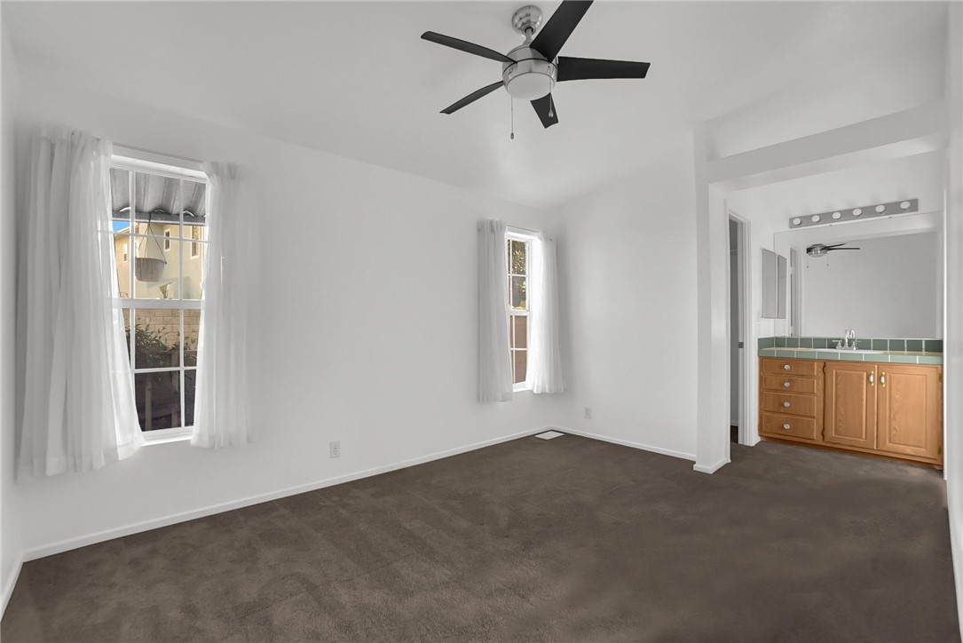 Master Bedroom with vanity - 5200 Heil Avenue 28, Huntington Beach CA 92649 - photo 8