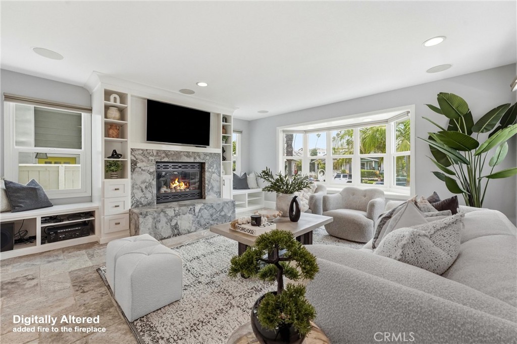 Family room with gas fireplace - 613 9th, Huntington Beach CA 92648 - photo 18