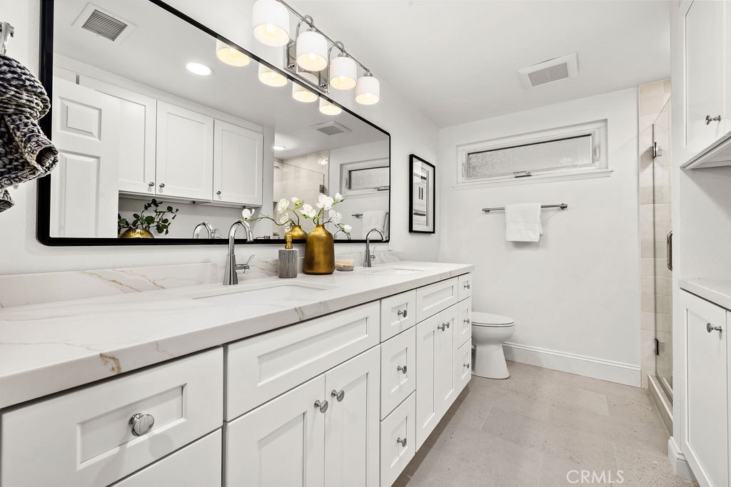 Remodeled 3/4 Bathroom with Dual Sink Countertop & Linen Storage - 6402 Athena Drive, Huntington Beach CA 92647 - photo 15