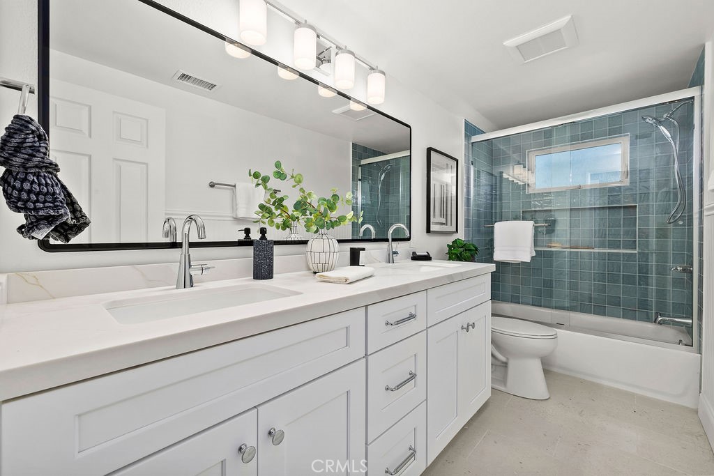 Remodeled Upstairs Hall bathroom with Dual Sink Counter Top - 6402 Athena Drive, Huntington Beach CA 92647 - photo 20