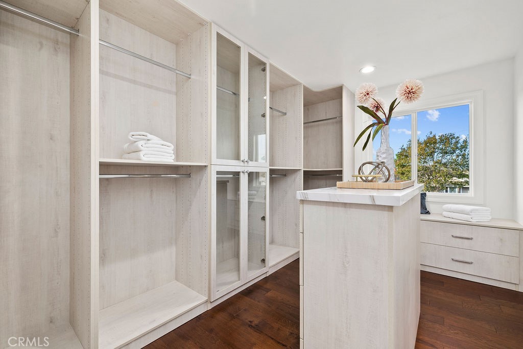 New Primary Walk-In Closet with Custom Cabinetry, Island - 6402 Athena Drive, Huntington Beach CA 92647 - photo 26