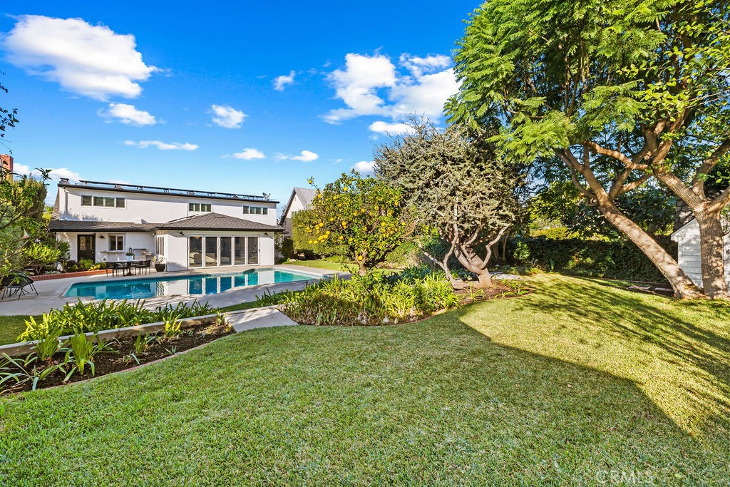 Expansive Grounds Upper level area view of Pool and home - 6402 Athena Drive, Huntington Beach CA 92647 - photo 32