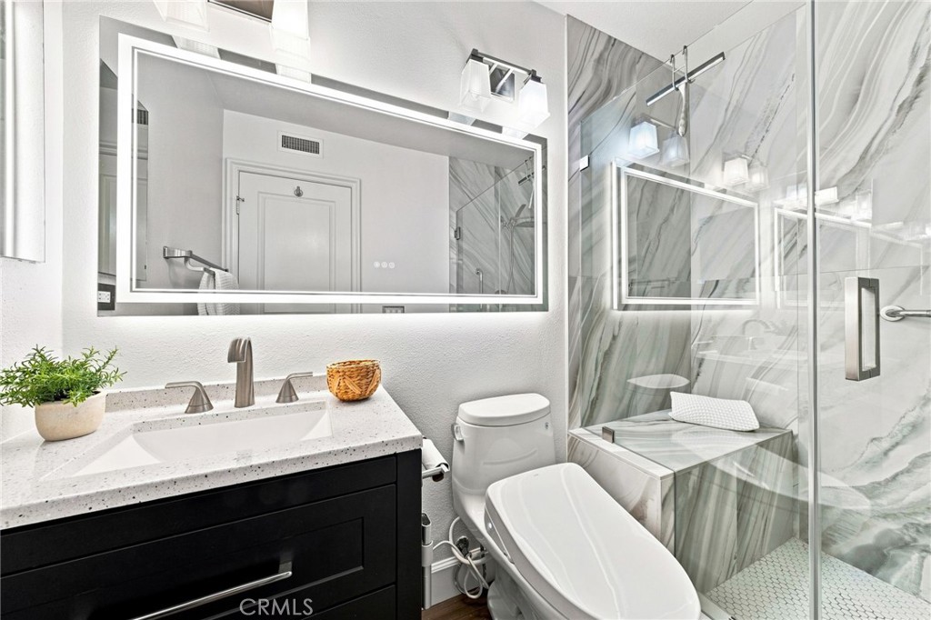 Attached downstairs bathroom - 6416 Setting Sun Drive, Huntington Beach CA 92648 - photo 33