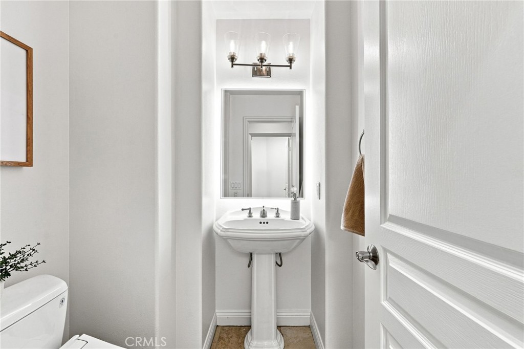 Downstairs guest powder room - 6416 Setting Sun Drive, Huntington Beach CA 92648 - photo 34