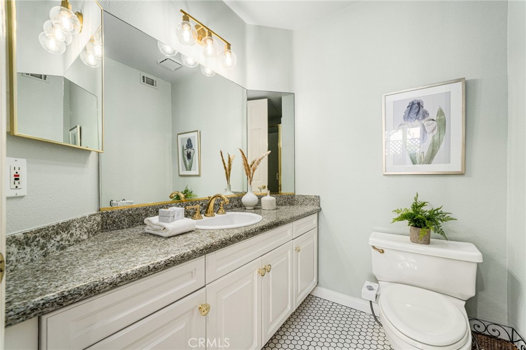 Main floor bathroom w/a shower. - 6461 Morningside Drive, Huntington Beach CA 92648 - photo 23